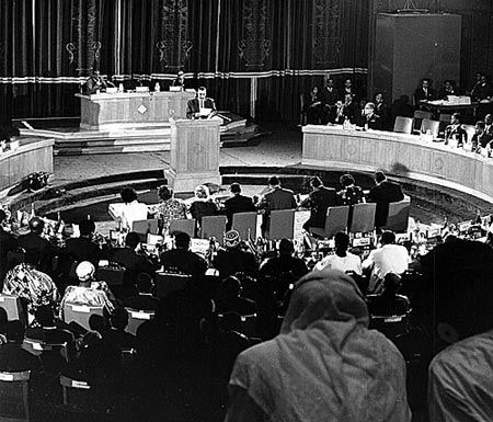 Heads of state and delegates seated in assembly at an African summit in 1964, in the years following the founding of the Organisation of African Unity